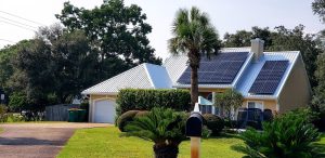 beach house with solar panels on the rooftop