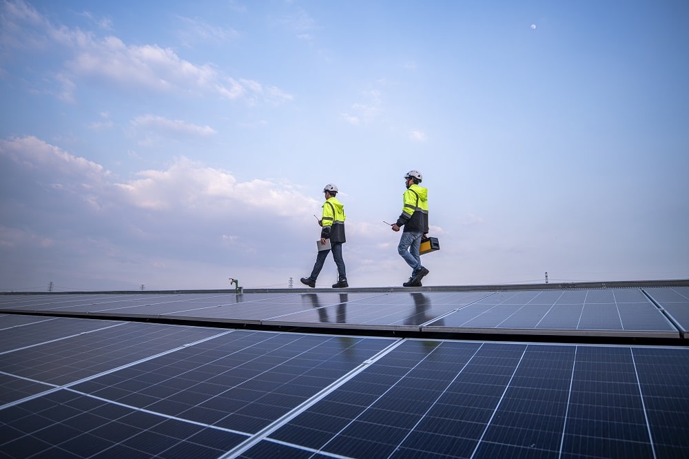 engineers walking on factory roof
